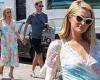 Paris Hilton is pretty in pastel wraparound dress as she holds hands with ...