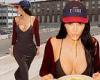 Kim Kardashian shows off her chest in a VERY plunging dress as enjoys a bowl of ...