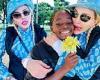 Madonna sticks out her tongue and cuddles up to her beaming daughter Estere