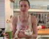 Amber Heard poses in a kitchen with her baby girl Oonagh who was born via ...