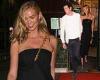 Karlie Kloss looks chic in a bandeau black dress as she holds hands with her ...