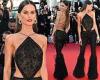 Izabel Goulart dazzles in a black glitzy backless top and feathered trousers in ...
