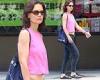 Katie Holmes wows as she flashes her abs in bright pink top