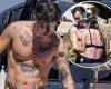 Harry Styles shows off his toned physique as he and girlfriend Olivia Wilde ...