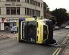 Four people are hurt as ambulance collides with another vehicle and overturns ...
