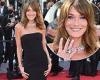 Carla Bruni wows in a strapless black gown as she takes to the red carpet for ...
