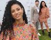Vick Hope puts on a leggy display in an orange floral dress and chunky boots