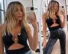 Nadia Bartel shows off her ripped abs and perky posterior in a pair of leather ...