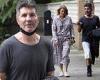 Simon Cowell looks casual in a grey T-shirt and white shorts during outdoor ...