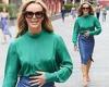 Amanda Holden showcases her trendy sense of style in a green blouse and blue ...