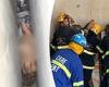 Crews rescue naked woman wedged in 8-inch space between two commercial ...