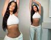 Kim Kardashian puts her 24INCH waist on display in crop top