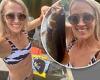 Carrie Underwood shows off her toned abs in a bikini while 'catch and release' ...