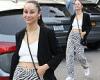 Cara Santana shows taut abs in a white crop top and zebra mom jeans combo in ...