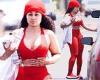Blac Chyna flaunts her famous curves in a red crop top and matching leggings as ...