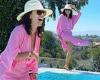 Eva Longoria is in high spirits as she poses next to a pool in a summery pink ...