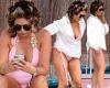 Amy Childs relaxes by the pool in plunging pink swimsuit and curlers on Ibiza ...