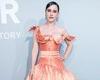 Rachel Brosnahan exudes elegance in a peach satin gown at amfAR Gala