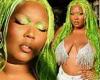 Lizzo models glittering metallic bra and 'slime green' hairdo