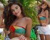 Olivia Culpo is vacation-ready in a colorful tube top and white cut-off shorts ...