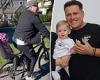 Karl Stefanovic takes daughter Harper May, one, for a bicycle ride in Sydney