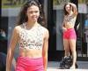 Vanessa Bauer shows washboard abs and slender legs in cropped top and hot pink ...