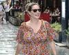 Kelly Brook looks chic in floaty floral dress and tan sandals