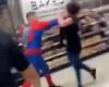 Shocking moment thug in Spider-Man outfit PUNCHES female Asda worker in FACE