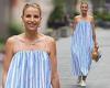 Vogue Williams cuts a stylish figure in an oversize striped summer dress