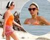 Simon Cowell's girlfriend Lauren Silverman wear an orange swimsuit during ...