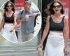 Katie Holmes stuns in a black tank top and flowing white pants while stepping ...