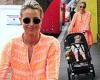 Vogue Williams stands out from the crowd in flowing orange dress as she heads ...