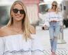 Vogue Williams looks typically stylish in a ruffled bardot blouse and jeans for ...