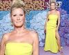 Sandra Lee, 55, shows a lot of leg in a sexy slit dress
