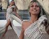 Heidi Klum exudes glamour as she twirls on her yacht wearing a dazzling couture ...