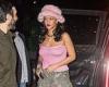 Rihanna goes braless under pastel pink top paired with a furry hat