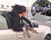 Moment woman leans out car window with an AK47 at illegal speeding event in San ...
