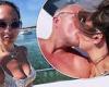 Myleene Klass puckers up to fiancé Simon during family holiday
