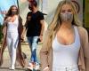 Carmen Electra shows off her ample cleavage in a low cut white top and skinny ...