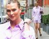 Karlie Kloss is all smiles as she struts around NYC in a lavender dress shirt ...