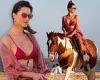 Alessandra Ambrosio is simply stunning as she rides a horse along the beach in ...