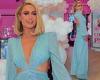 Paris Hilton puts on a glamorous display in cut-out blue gown