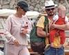 Orlando Bloom cradles daughter Daisy Dove as he and fiancée Katy Perry board ...