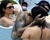 Travis Barker shows bikini-clad Kourtney Kardashian some love as they splash ...