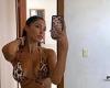 Model London Goheen shows off her very ample cleavage in an animal print bikini
