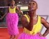 Cynthia Erivo makes a glam fashion statement in a yellow top and feathered pink ...
