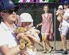 Barron Hilton holds his daughter at the Malibu Chili Cook-Off with wife Tessa ...