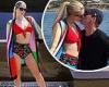 Paris Hilton rocks a red bikini while sharing a kiss with fiance Carter Reum on ...