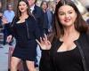 Selena Gomez looks like a bombshell donning a little black dress with a bold ...