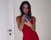 Victoria Beckham flaunts her enviable figure in a bright red dress from her ...